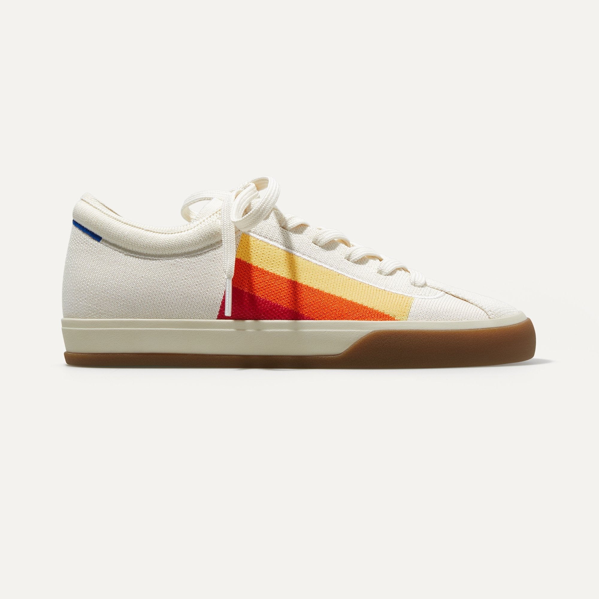 The Lace Up sneakers in Yellow Candy Stripe shown from a side view showing the outsole.
