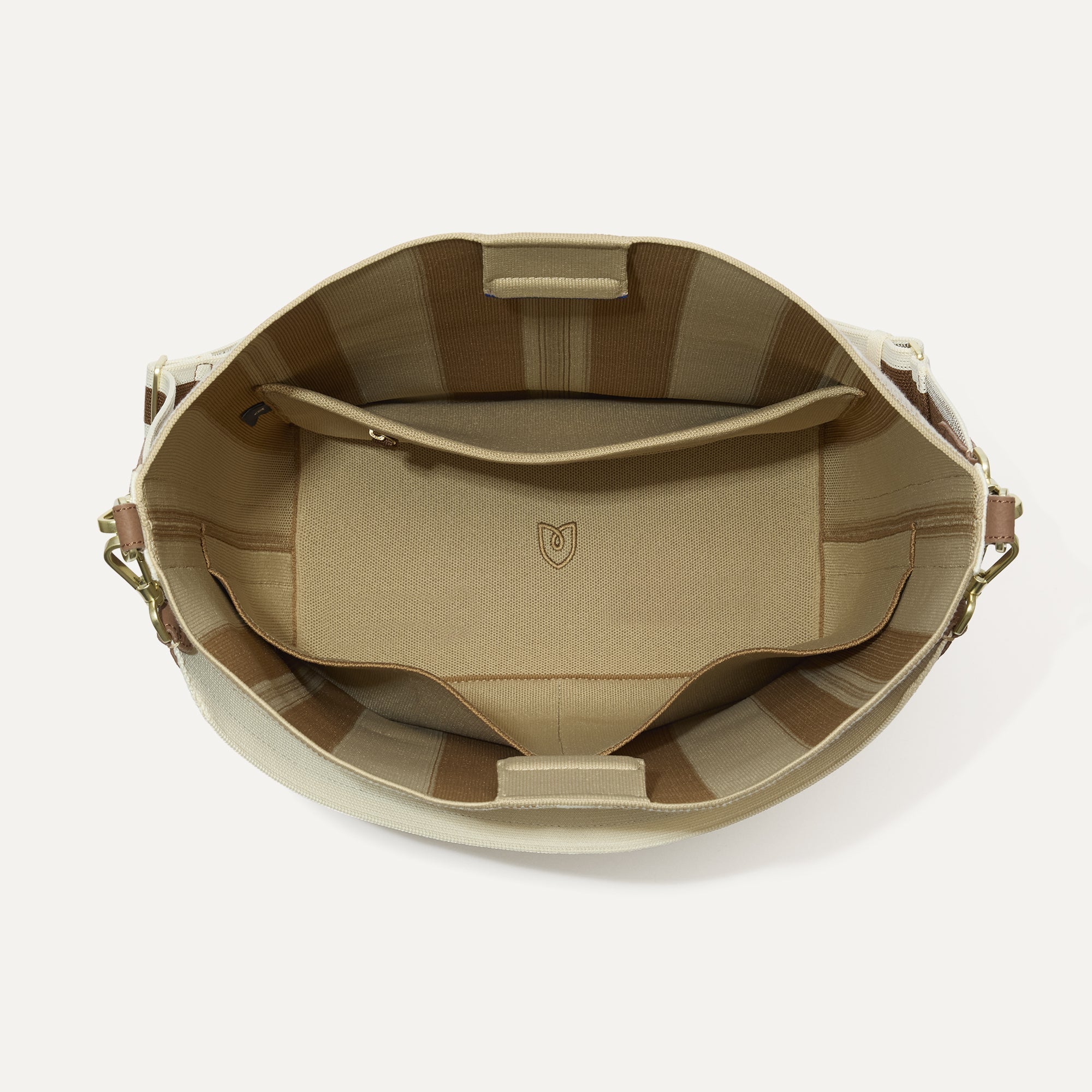 The Bucket Bag in Oat Latte shown from the top with base insert.