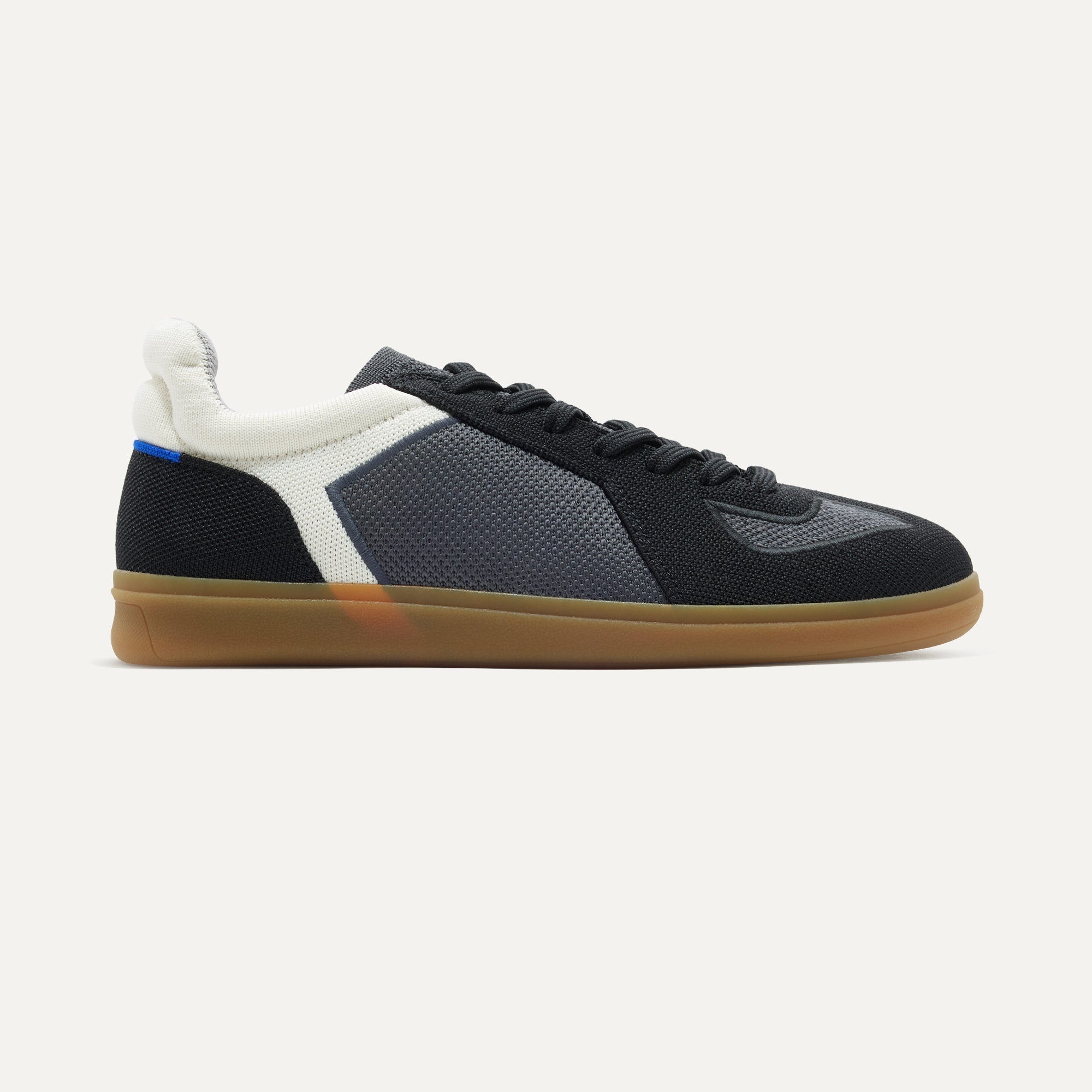 side | The RS01 Sneaker in Obsidian Black shown from the side.