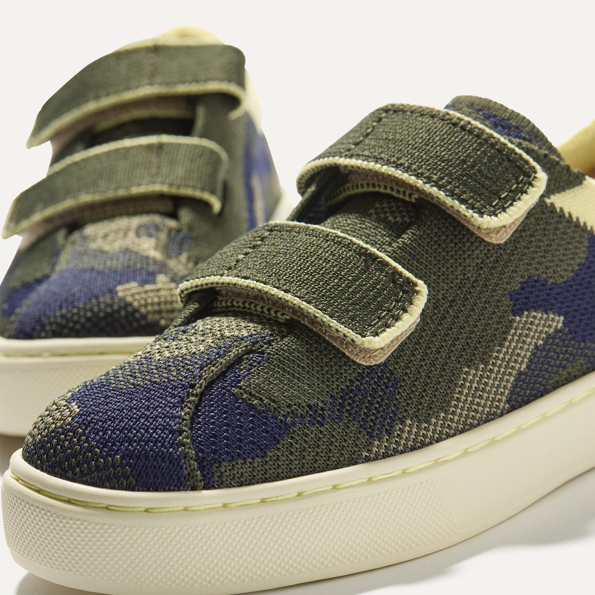 Close up of the vamp of The Kids Strap Sneaker in Spruce Camo. 