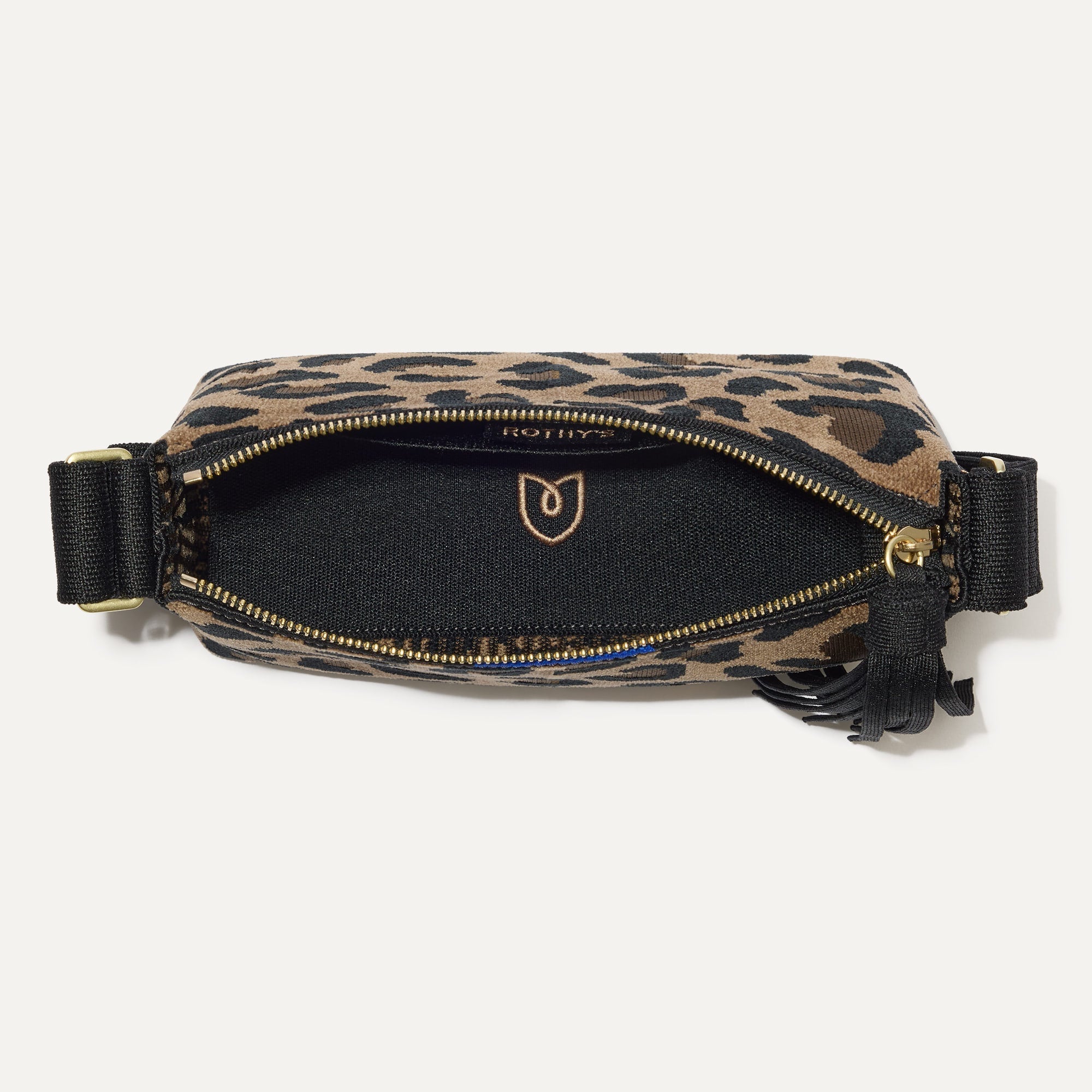 The ReVelvet Casual Crossbody in ReVelvet Cat with the interior exposed. 