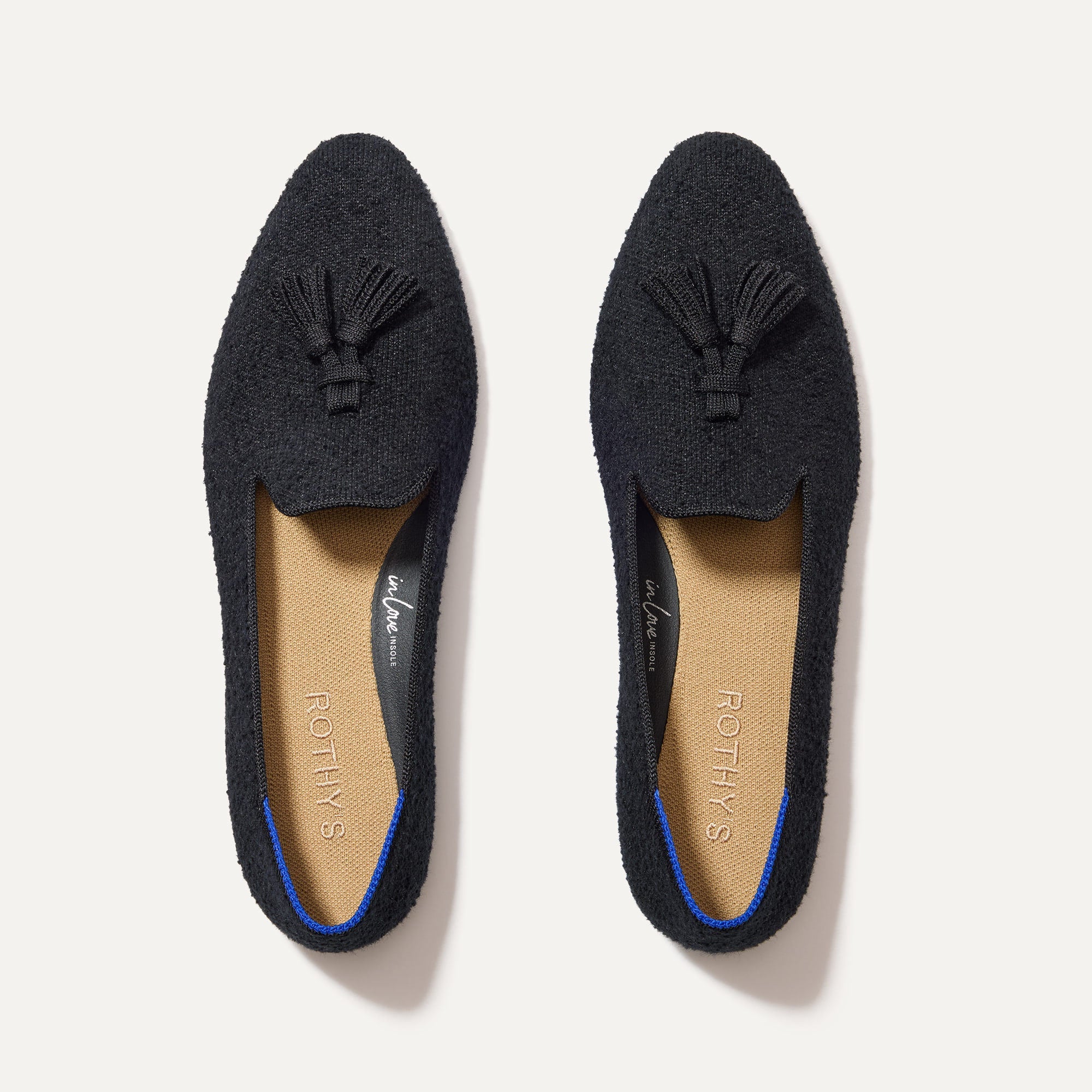 The Almond Tassel Loafer in Black Bouclé shown from the top. 
