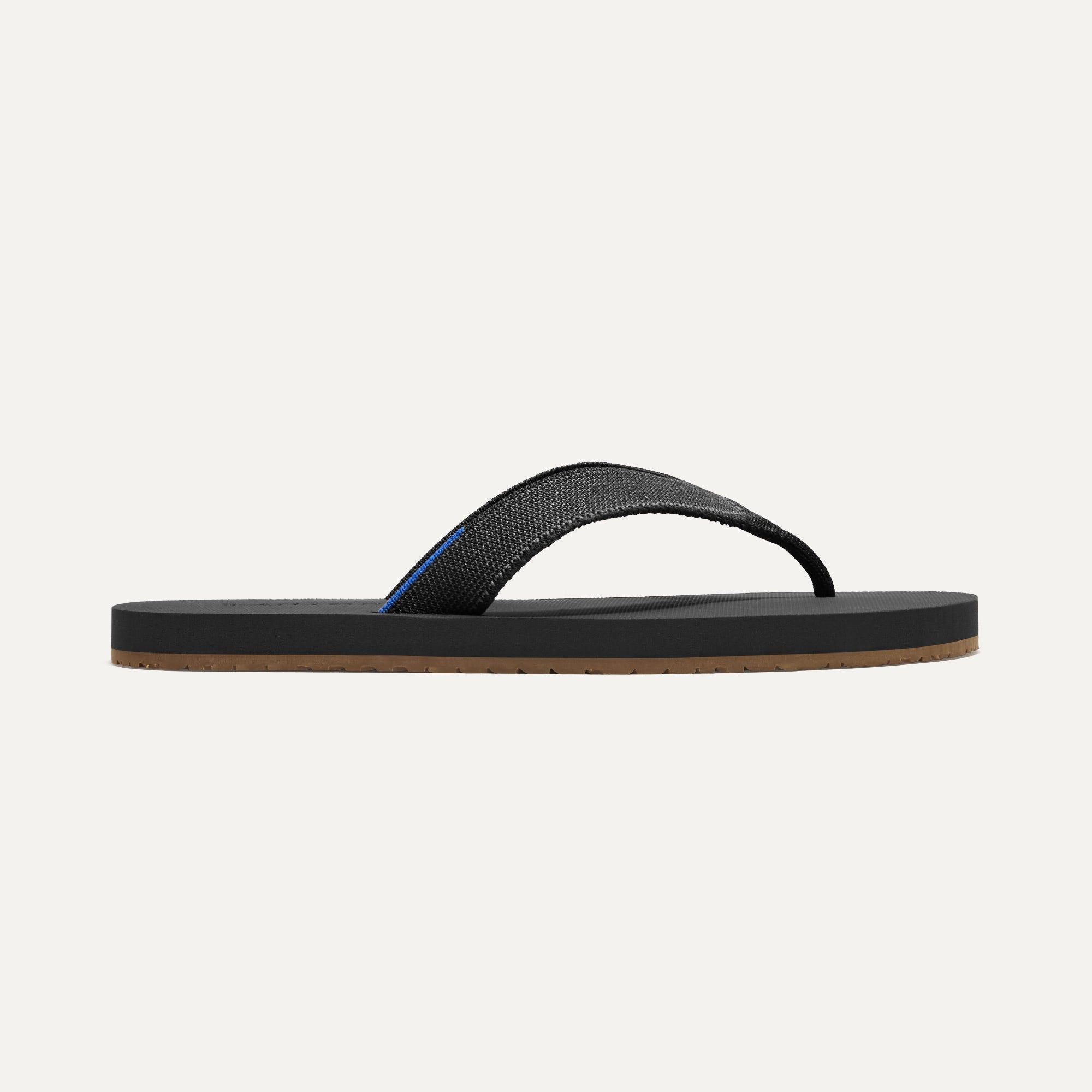 The Men's Flip Flop in Black shown from the side.