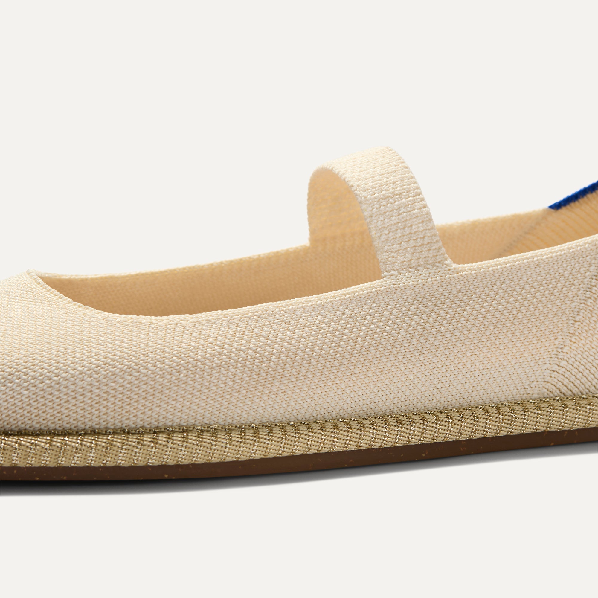 The vamp and top strap of The Cruiser Mary Jane in White Sand. 