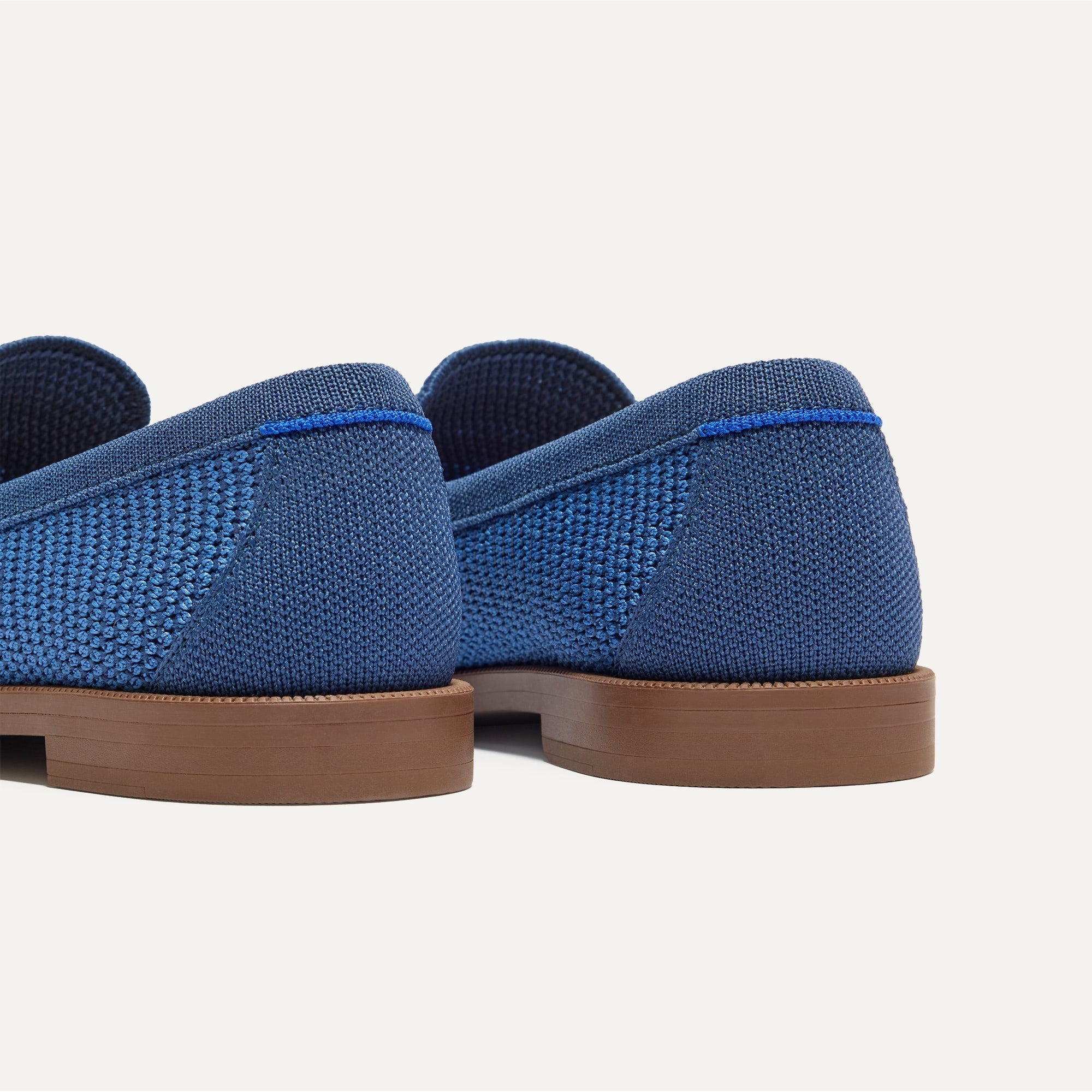 Close up of the heel of The Penny Loafer in Blue Raffia-Knit, with Rothy's signature blue halo. 