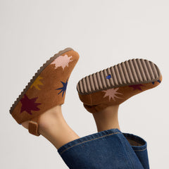 hover | Model wearing The Kids Clog in ReVelvet™ Butterscotch Burst. 
