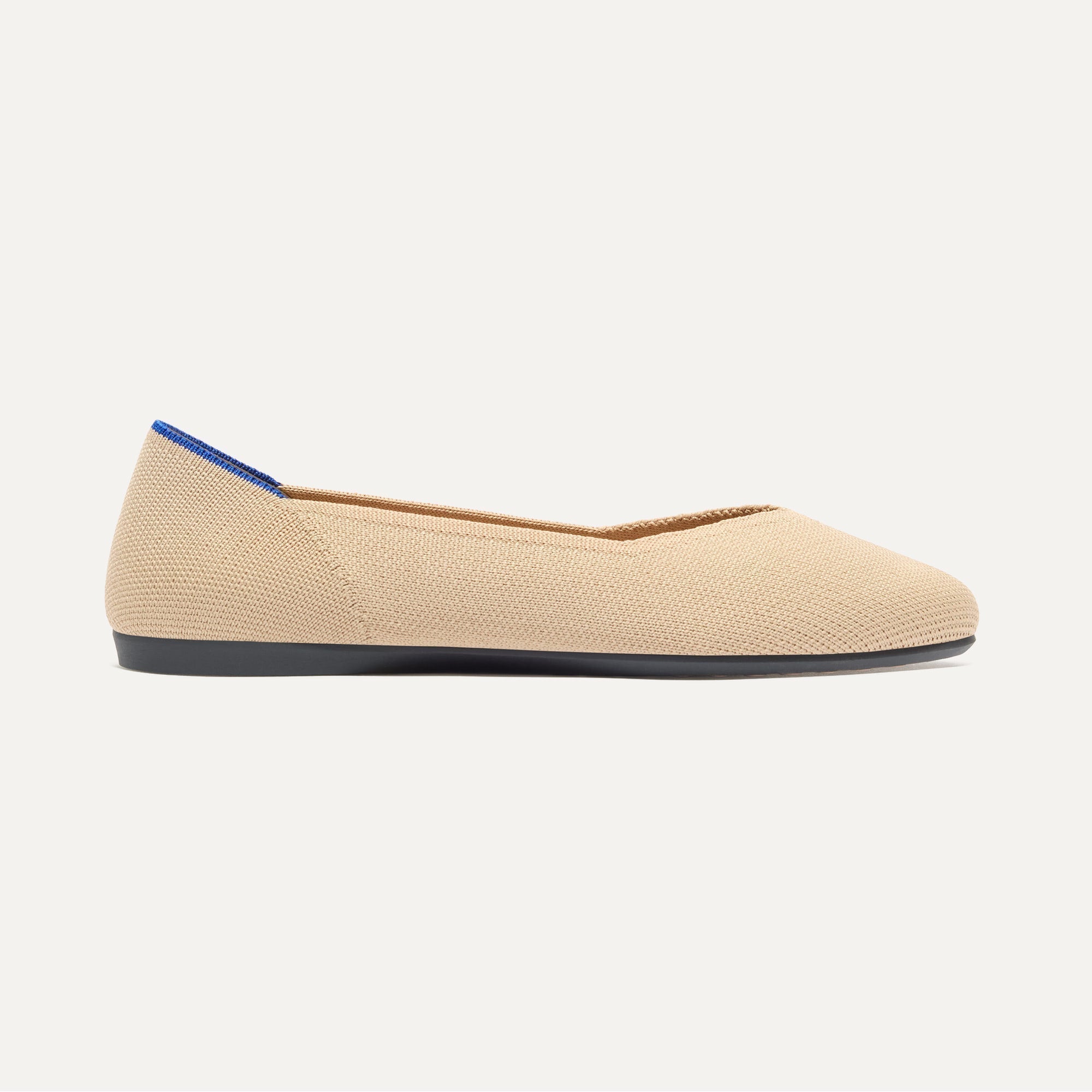 side | The Daily Flat in Ecru shown from the side. 