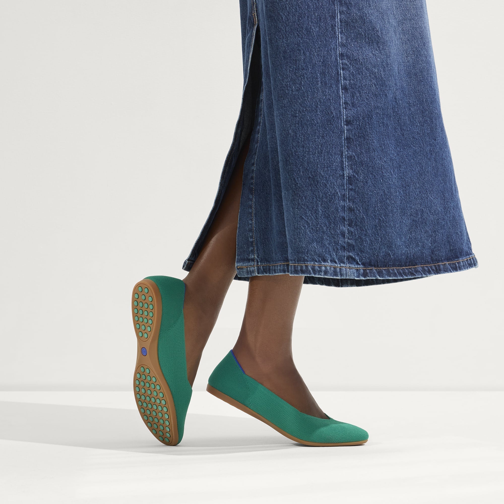 hover | Model wearing The Daily Flat in Clover. 