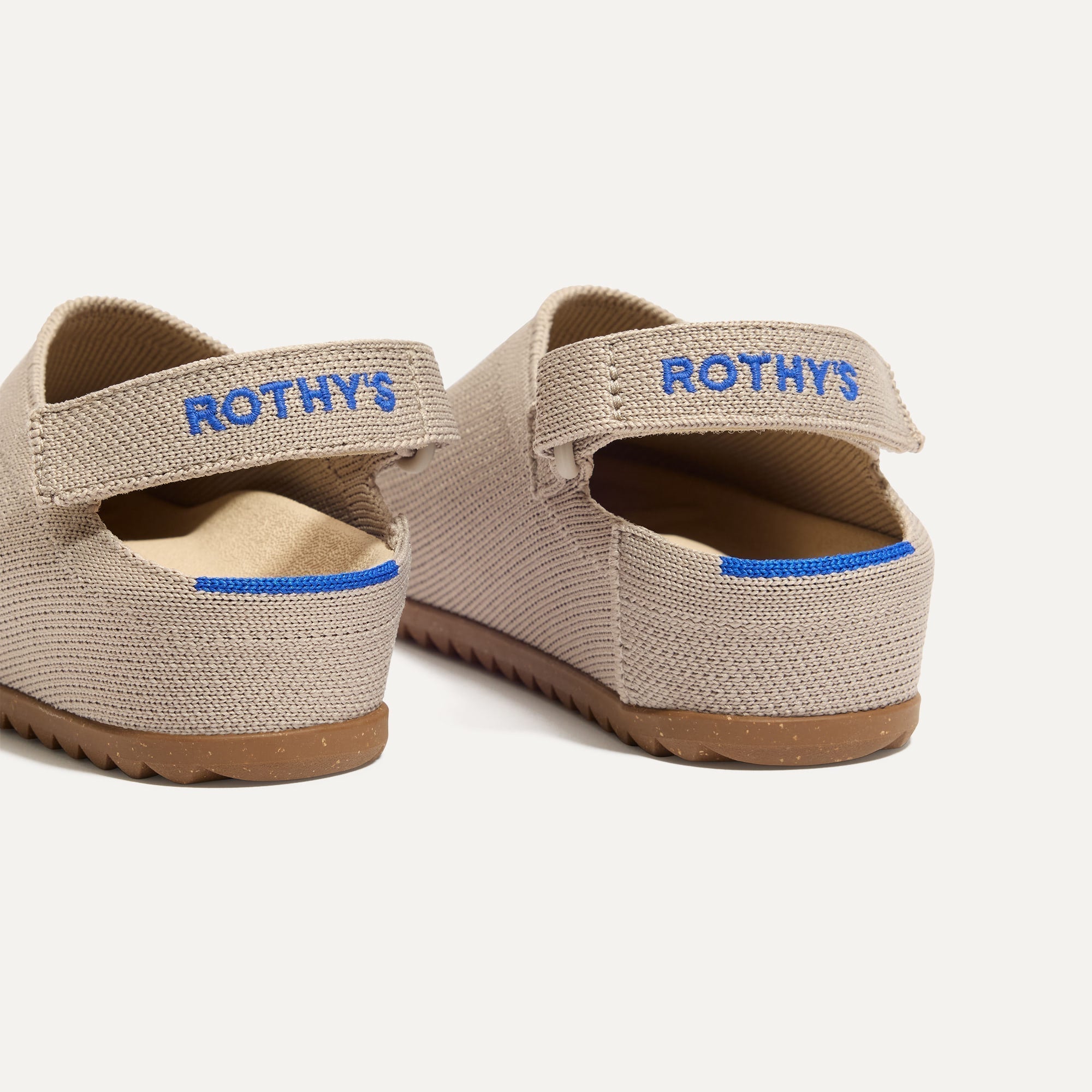 Close up of the heel of The Kids Clog in Dove, with Rothy's signature blue halo. 