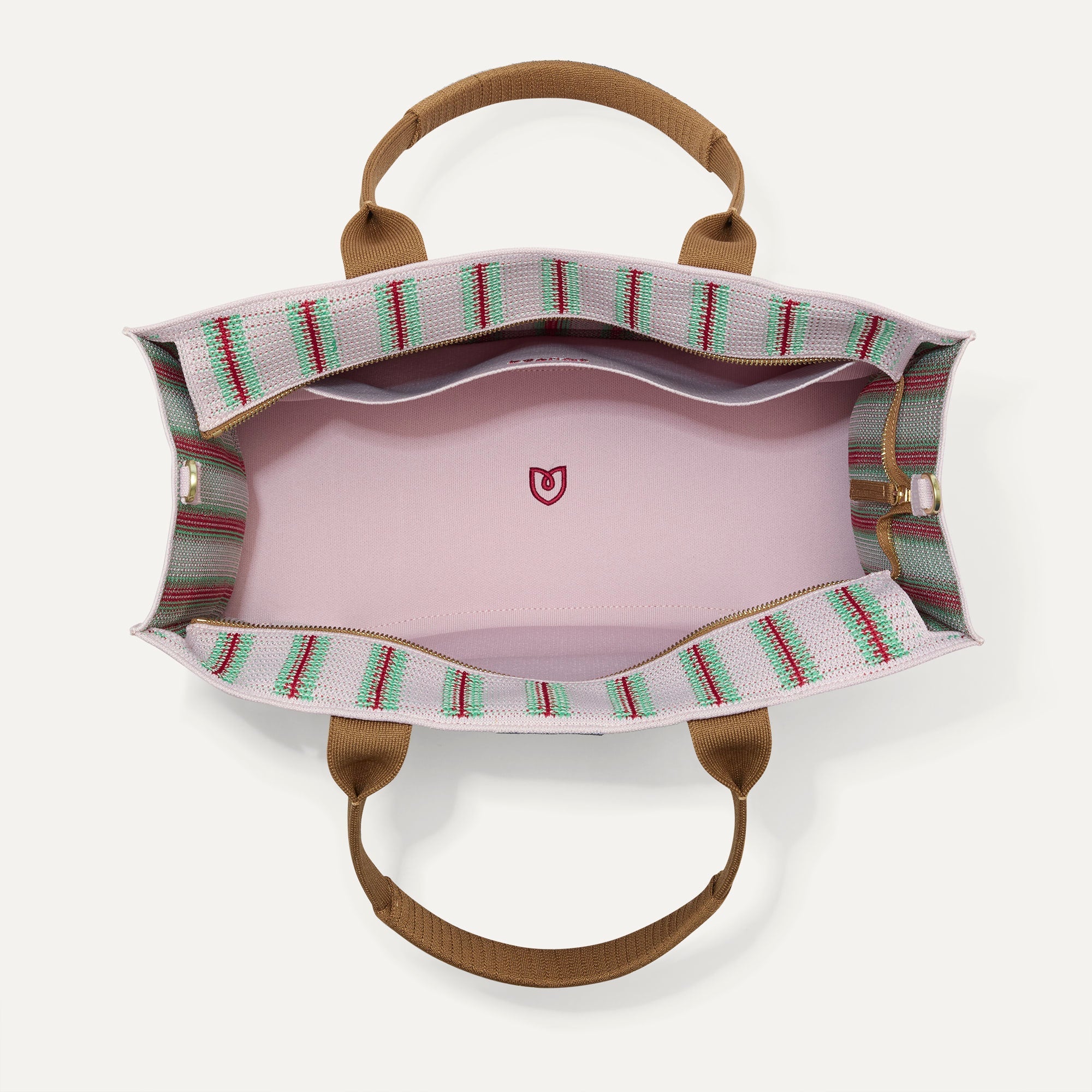 The Classic Tote in Watermelon Market Stripe, shown from above, with the interior exposed.